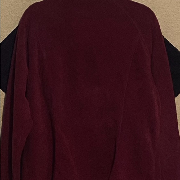 Crafted with cozy, plush fleece, zippered pockets, and a cold-blocking collar. - Picture 2 of 5